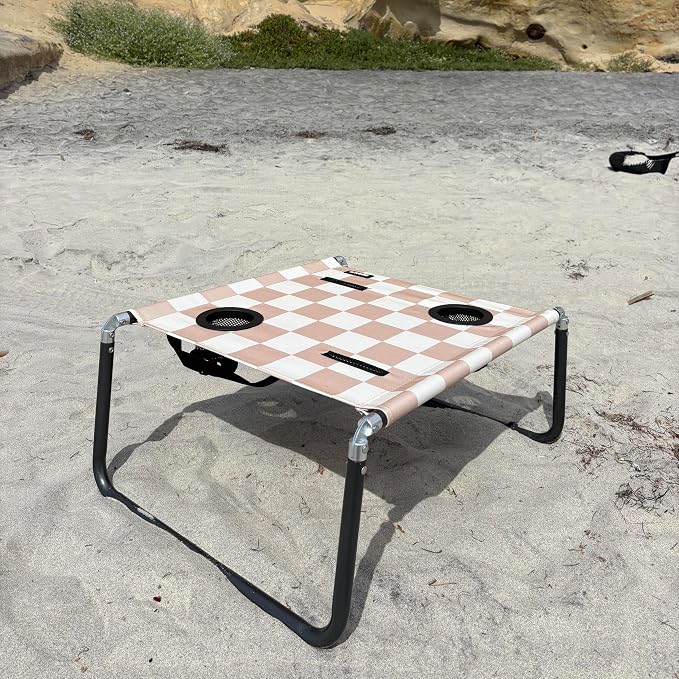 Neso Beach Table - Lightweight, Portable and Foldable Table for Beach, Camping and Outdoor Adventures - Stable Surface - with Cup Holder for Drinks and Phone Pockets - Tan Checkers
